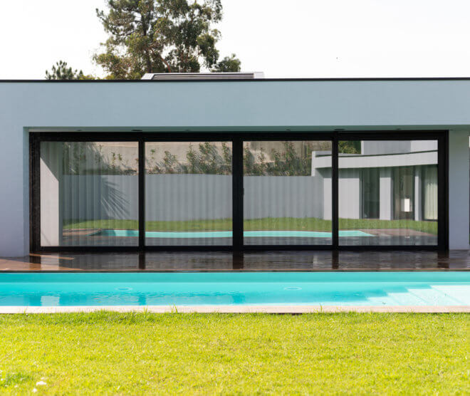 upvc sliding doors opening to a pool